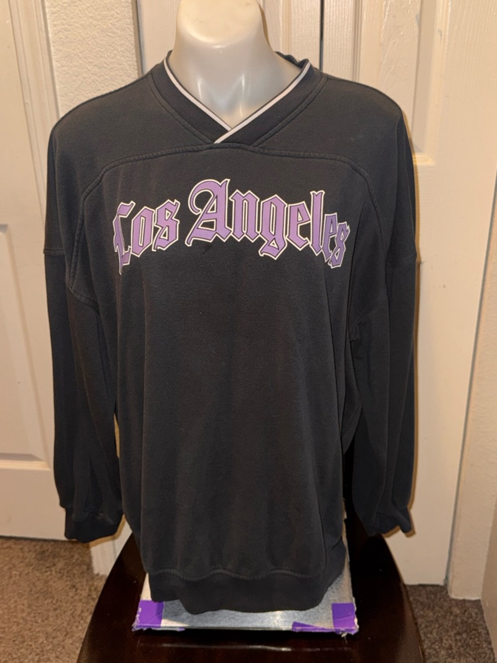 Divided Black V-Neck Sweatshirt with Lavender 'Los Angeles' Script